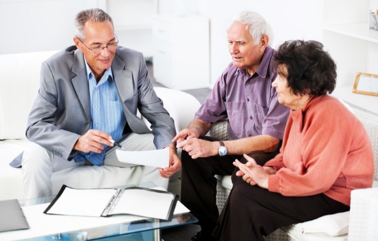 An attorney discussing Estate Planning in South Carolina with an elderly couple