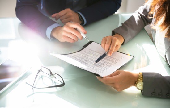 A Business Lawyer in Kiawah Island SC Drafting Documents with Client