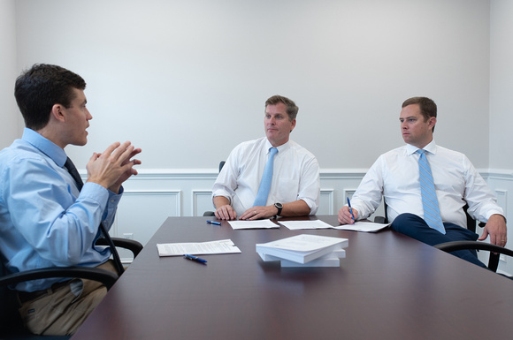A Business Attorney in Daniel Island SC discussing client with other Buxton & Collie attorneys