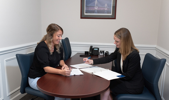 A Title Attorney for Mt. Pleasant SC going over the details of a title search with their client