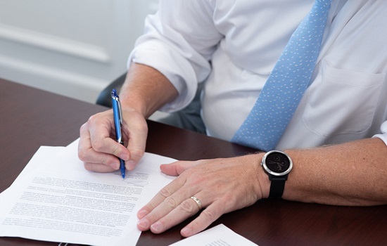 A Closing Attorney in Kiawah Island SC finalizing paperwork for a real estate sale